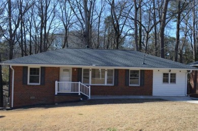 Welcome to this charming 3-bedroom, 2-bath, 4-sided brick ranch on Browns Mill Golf Course in Georgia - for sale on GolfHomes.com, golf home, golf lot