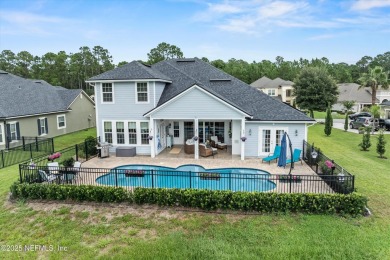 Imagine living in this stunning 2016 custom-built pool home on Magnolia Point Golf and Country Club in Florida - for sale on GolfHomes.com, golf home, golf lot
