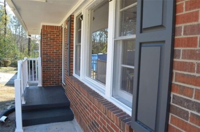 Welcome to this charming 3-bedroom, 2-bath, 4-sided brick ranch on Browns Mill Golf Course in Georgia - for sale on GolfHomes.com, golf home, golf lot