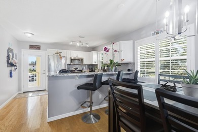 Desirable corner 'B' unit with split bedrooms and sweeping lake on The American Golf Club in Florida - for sale on GolfHomes.com, golf home, golf lot