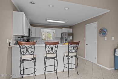 Stunning 4-bedroom, 3.5-bathroom home nestled on Hole 15 of the on Brandywine Bay Golf Club in North Carolina - for sale on GolfHomes.com, golf home, golf lot