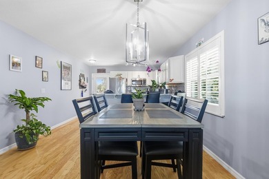 Desirable corner 'B' unit with split bedrooms and sweeping lake on The American Golf Club in Florida - for sale on GolfHomes.com, golf home, golf lot