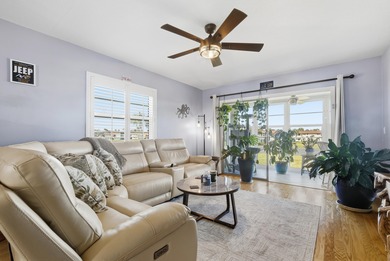 Desirable corner 'B' unit with split bedrooms and sweeping lake on The American Golf Club in Florida - for sale on GolfHomes.com, golf home, golf lot