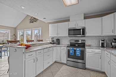 Stunning 4-bedroom, 3.5-bathroom home nestled on Hole 15 of the on Brandywine Bay Golf Club in North Carolina - for sale on GolfHomes.com, golf home, golf lot