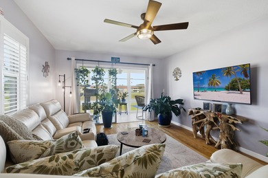 Desirable corner 'B' unit with split bedrooms and sweeping lake on The American Golf Club in Florida - for sale on GolfHomes.com, golf home, golf lot