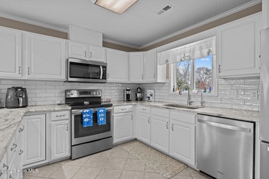 Stunning 4-bedroom, 3.5-bathroom home nestled on Hole 15 of the on Brandywine Bay Golf Club in North Carolina - for sale on GolfHomes.com, golf home, golf lot