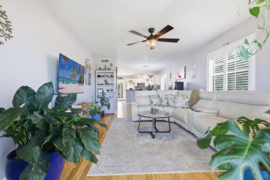 Desirable corner 'B' unit with split bedrooms and sweeping lake on The American Golf Club in Florida - for sale on GolfHomes.com, golf home, golf lot