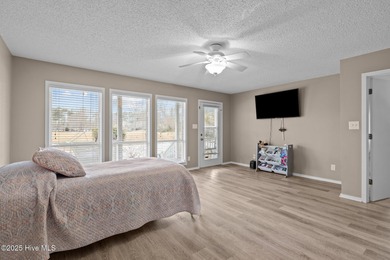 Stunning 4-bedroom, 3.5-bathroom home nestled on Hole 15 of the on Brandywine Bay Golf Club in North Carolina - for sale on GolfHomes.com, golf home, golf lot