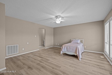 Stunning 4-bedroom, 3.5-bathroom home nestled on Hole 15 of the on Brandywine Bay Golf Club in North Carolina - for sale on GolfHomes.com, golf home, golf lot