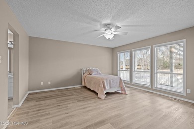 Stunning 4-bedroom, 3.5-bathroom home nestled on Hole 15 of the on Brandywine Bay Golf Club in North Carolina - for sale on GolfHomes.com, golf home, golf lot