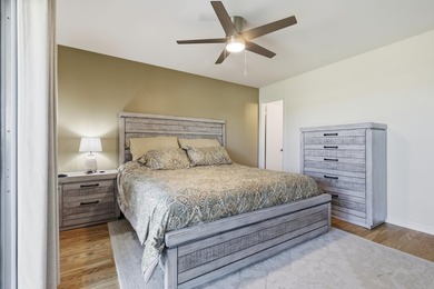 Desirable corner 'B' unit with split bedrooms and sweeping lake on The American Golf Club in Florida - for sale on GolfHomes.com, golf home, golf lot