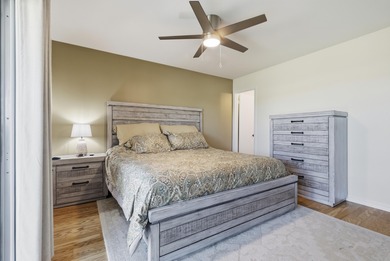 Desirable corner 'B' unit with split bedrooms and sweeping lake on The American Golf Club in Florida - for sale on GolfHomes.com, golf home, golf lot