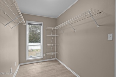 Stunning 4-bedroom, 3.5-bathroom home nestled on Hole 15 of the on Brandywine Bay Golf Club in North Carolina - for sale on GolfHomes.com, golf home, golf lot