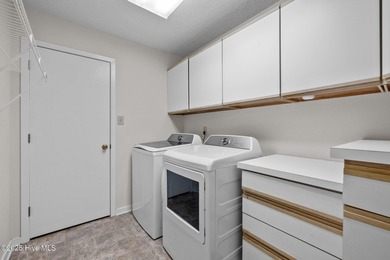 Stunning 4-bedroom, 3.5-bathroom home nestled on Hole 15 of the on Brandywine Bay Golf Club in North Carolina - for sale on GolfHomes.com, golf home, golf lot