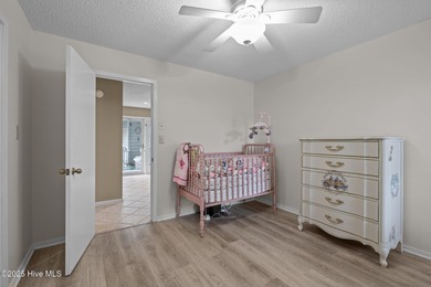 Stunning 4-bedroom, 3.5-bathroom home nestled on Hole 15 of the on Brandywine Bay Golf Club in North Carolina - for sale on GolfHomes.com, golf home, golf lot