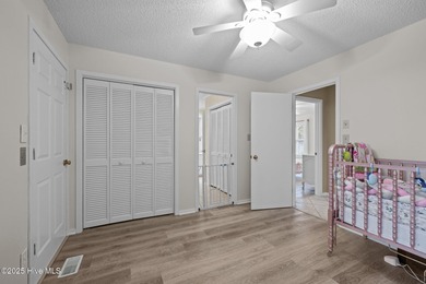 Stunning 4-bedroom, 3.5-bathroom home nestled on Hole 15 of the on Brandywine Bay Golf Club in North Carolina - for sale on GolfHomes.com, golf home, golf lot