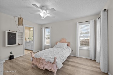 Stunning 4-bedroom, 3.5-bathroom home nestled on Hole 15 of the on Brandywine Bay Golf Club in North Carolina - for sale on GolfHomes.com, golf home, golf lot