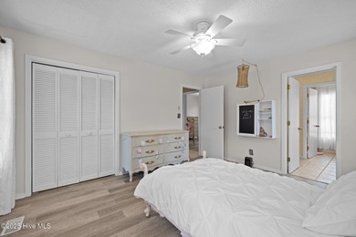 Stunning 4-bedroom, 3.5-bathroom home nestled on Hole 15 of the on Brandywine Bay Golf Club in North Carolina - for sale on GolfHomes.com, golf home, golf lot