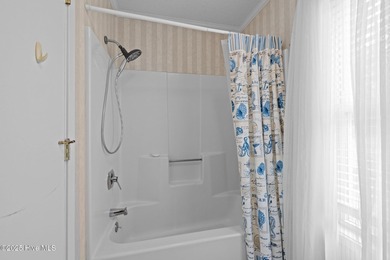 Stunning 4-bedroom, 3.5-bathroom home nestled on Hole 15 of the on Brandywine Bay Golf Club in North Carolina - for sale on GolfHomes.com, golf home, golf lot