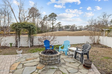 Stunning 4-bedroom, 3.5-bathroom home nestled on Hole 15 of the on Brandywine Bay Golf Club in North Carolina - for sale on GolfHomes.com, golf home, golf lot