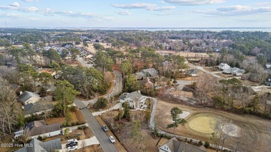 Stunning 4-bedroom, 3.5-bathroom home nestled on Hole 15 of the on Brandywine Bay Golf Club in North Carolina - for sale on GolfHomes.com, golf home, golf lot