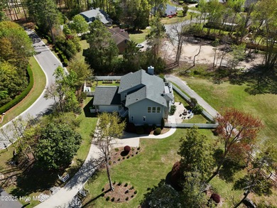 Stunning 4-bedroom, 3.5-bathroom home nestled on Hole 15 of the on Brandywine Bay Golf Club in North Carolina - for sale on GolfHomes.com, golf home, golf lot