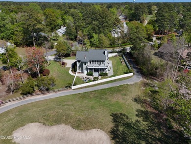 Stunning 4-bedroom, 3.5-bathroom home nestled on Hole 15 of the on Brandywine Bay Golf Club in North Carolina - for sale on GolfHomes.com, golf home, golf lot