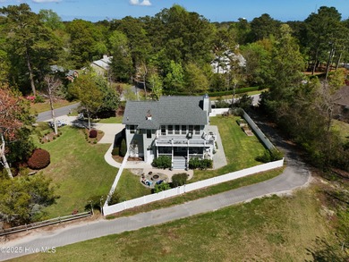 Stunning 4-bedroom, 3.5-bathroom home nestled on Hole 15 of the on Brandywine Bay Golf Club in North Carolina - for sale on GolfHomes.com, golf home, golf lot