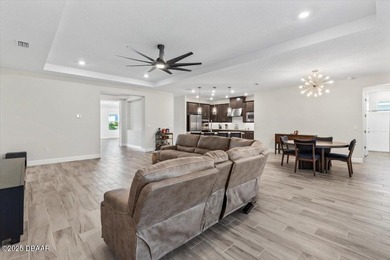 Experience luxury living in the gated Windchase section of on Halifax Plantation Golf Club in Florida - for sale on GolfHomes.com, golf home, golf lot