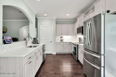 Welcome to this breathtaking 5-bedroom retreat, perfectly on Beau Rivage Golf and Resort in North Carolina - for sale on GolfHomes.com, golf home, golf lot