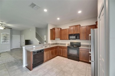 Welcome to 12952 Utopia Gardens Way - Tranquil Living with Water on Summerfield Crossing Golf Club in Florida - for sale on GolfHomes.com, golf home, golf lot