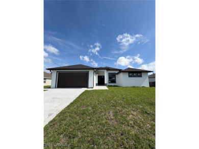 This stunning new construction features impact windows and doors on Burnt Store Golf Club in Florida - for sale on GolfHomes.com, golf home, golf lot