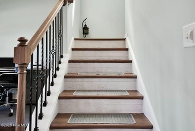 Welcome to this breathtaking 5-bedroom retreat, perfectly on Beau Rivage Golf and Resort in North Carolina - for sale on GolfHomes.com, golf home, golf lot