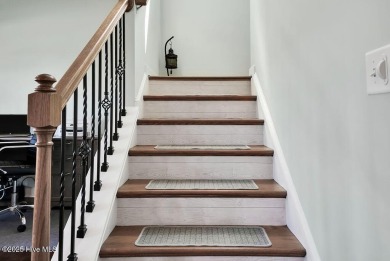 Welcome to this breathtaking 5-bedroom retreat, perfectly on Beau Rivage Golf and Resort in North Carolina - for sale on GolfHomes.com, golf home, golf lot