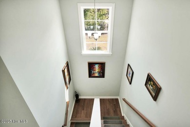 Welcome to this breathtaking 5-bedroom retreat, perfectly on Beau Rivage Golf and Resort in North Carolina - for sale on GolfHomes.com, golf home, golf lot