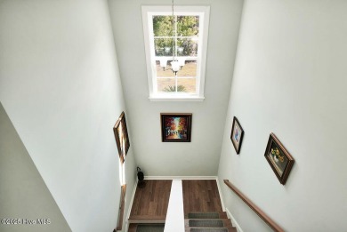 Welcome to this breathtaking 5-bedroom retreat, perfectly on Beau Rivage Golf and Resort in North Carolina - for sale on GolfHomes.com, golf home, golf lot