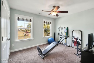 Welcome to this breathtaking 5-bedroom retreat, perfectly on Beau Rivage Golf and Resort in North Carolina - for sale on GolfHomes.com, golf home, golf lot