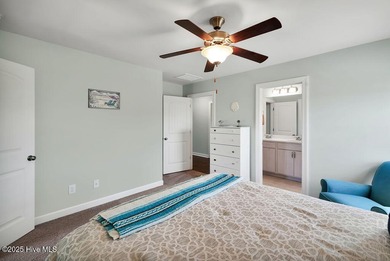 Welcome to this breathtaking 5-bedroom retreat, perfectly on Beau Rivage Golf and Resort in North Carolina - for sale on GolfHomes.com, golf home, golf lot