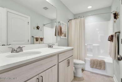 Welcome to this breathtaking 5-bedroom retreat, perfectly on Beau Rivage Golf and Resort in North Carolina - for sale on GolfHomes.com, golf home, golf lot