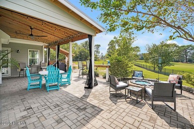 Welcome to this breathtaking 5-bedroom retreat, perfectly on Beau Rivage Golf and Resort in North Carolina - for sale on GolfHomes.com, golf home, golf lot