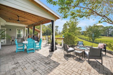 Welcome to this breathtaking 5-bedroom retreat, perfectly on Beau Rivage Golf and Resort in North Carolina - for sale on GolfHomes.com, golf home, golf lot