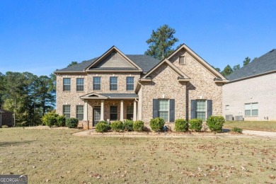 Experience unparalleled luxury in this stunning all-brick estate on Canongate At Heron Bay in Georgia - for sale on GolfHomes.com, golf home, golf lot