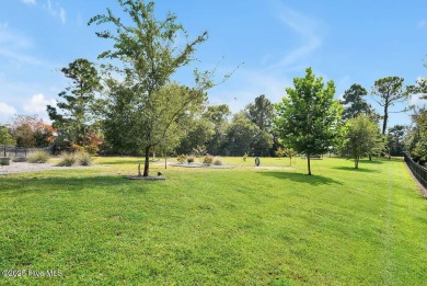 Welcome to this breathtaking 5-bedroom retreat, perfectly on Beau Rivage Golf and Resort in North Carolina - for sale on GolfHomes.com, golf home, golf lot