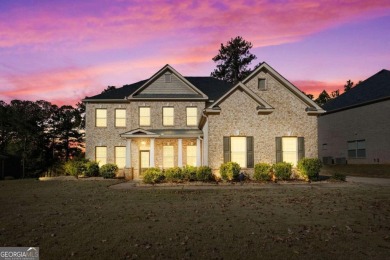 Experience unparalleled luxury in this stunning all-brick estate on Canongate At Heron Bay in Georgia - for sale on GolfHomes.com, golf home, golf lot