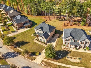 Experience unparalleled luxury in this stunning all-brick estate on Canongate At Heron Bay in Georgia - for sale on GolfHomes.com, golf home, golf lot