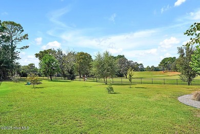 Welcome to this breathtaking 5-bedroom retreat, perfectly on Beau Rivage Golf and Resort in North Carolina - for sale on GolfHomes.com, golf home, golf lot