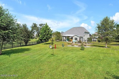 Welcome to this breathtaking 5-bedroom retreat, perfectly on Beau Rivage Golf and Resort in North Carolina - for sale on GolfHomes.com, golf home, golf lot