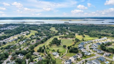 Welcome to this breathtaking 5-bedroom retreat, perfectly on Beau Rivage Golf and Resort in North Carolina - for sale on GolfHomes.com, golf home, golf lot