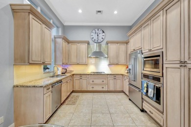Nestled in the RARELY available Sand Cay community, this lovely on Ibis Golf and Country Club in Florida - for sale on GolfHomes.com, golf home, golf lot