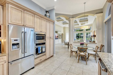 Nestled in the RARELY available Sand Cay community, this lovely on Ibis Golf and Country Club in Florida - for sale on GolfHomes.com, golf home, golf lot